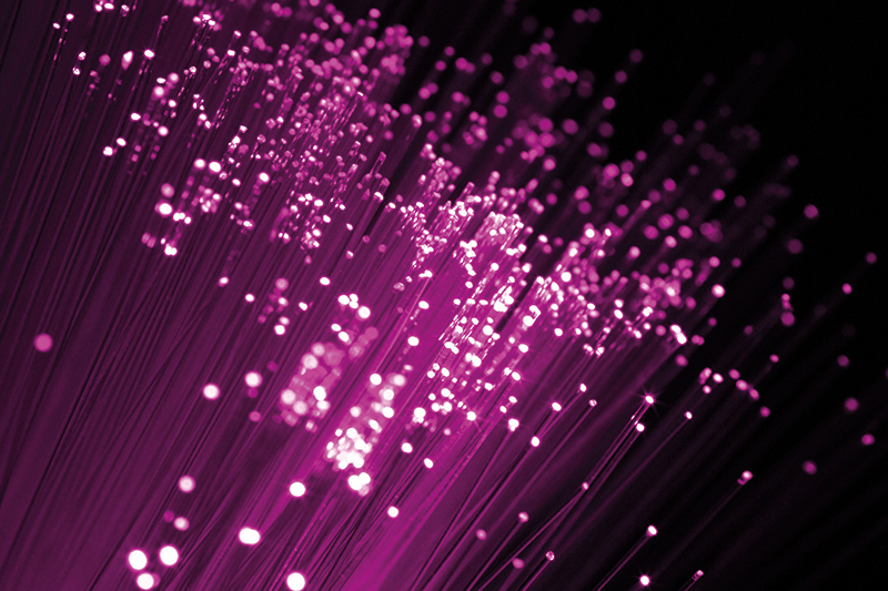 PantherMedia 1747285 Pink lights in front of dark background